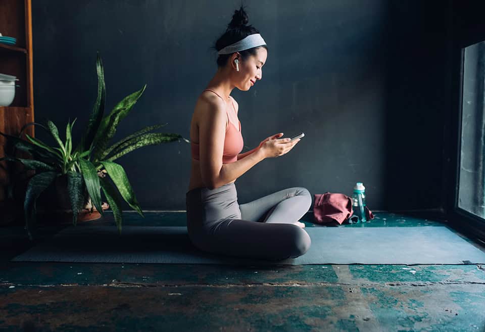 Person checking mobile wallet before working out