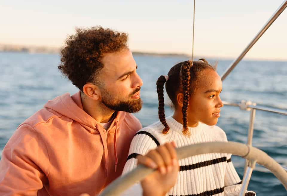 Parent and child riding on a boat