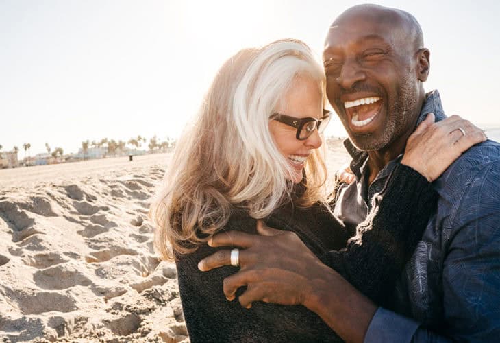 Couple on the beach enjoying their retirement