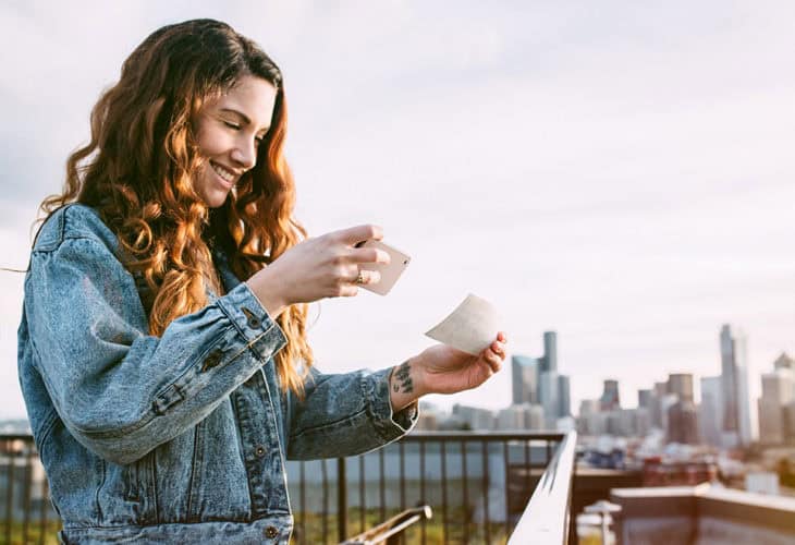 Woman using direct deposit, one of three must-have money management tools to save time