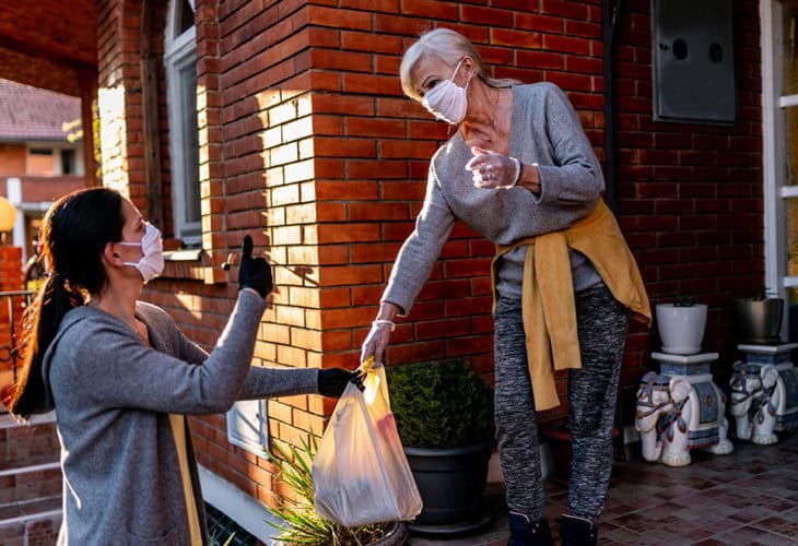 Volunteer delivering food to a neighbor during the pandemic