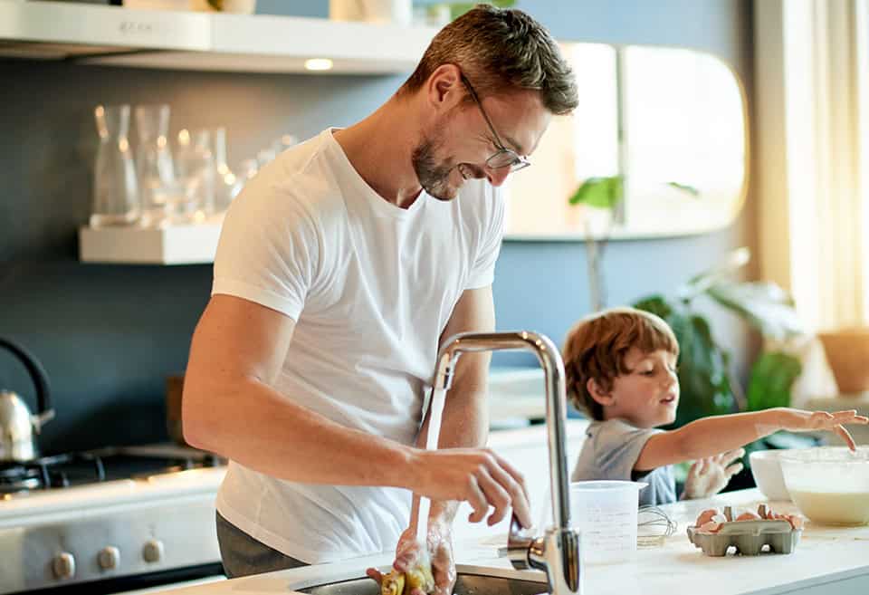 Parent and child baking together at home