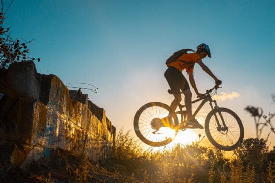Teenager Boy Mountain BikingTeenager Boy Mountain Biking Jumping at sunset at Carmel Mountain.