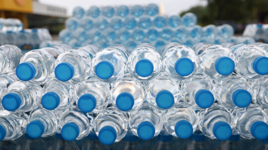 Large stack of water bottles