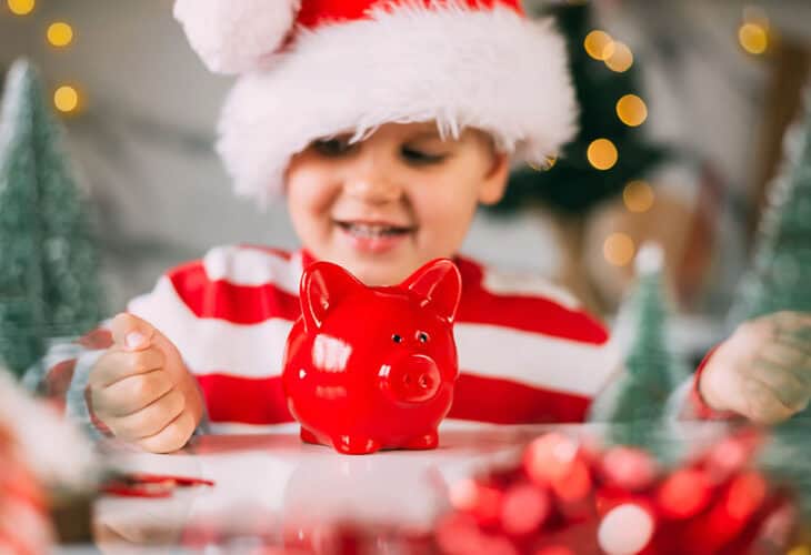 baby looking at pig saver
