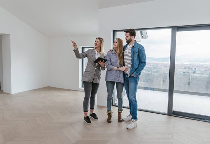 Couple looking at a place to rent or buy