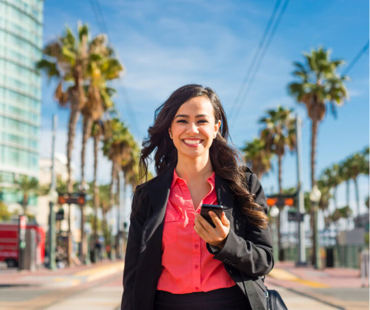 Hispanic businesswoman walking in Downtown, San Diego.