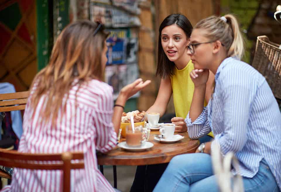 Group of friends discussing money.