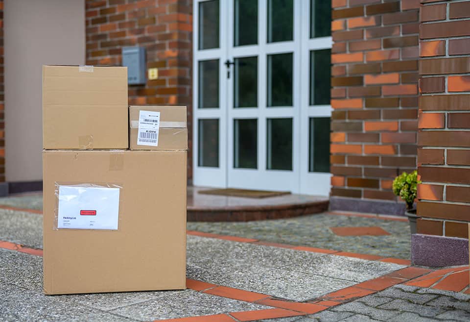 Packages sitting on porch by front door