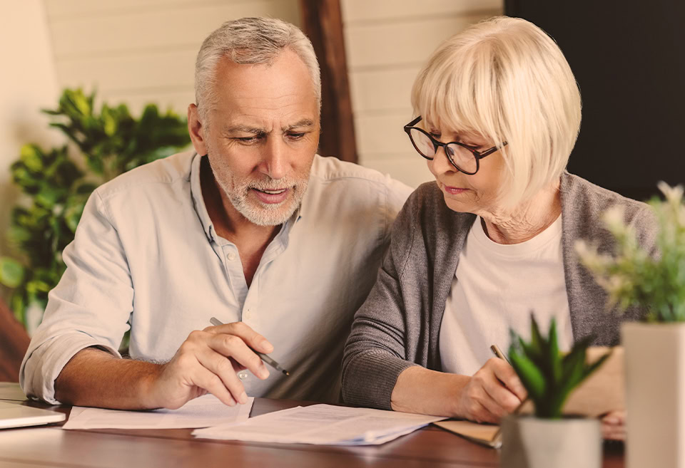 Mature couple looking at paperwork