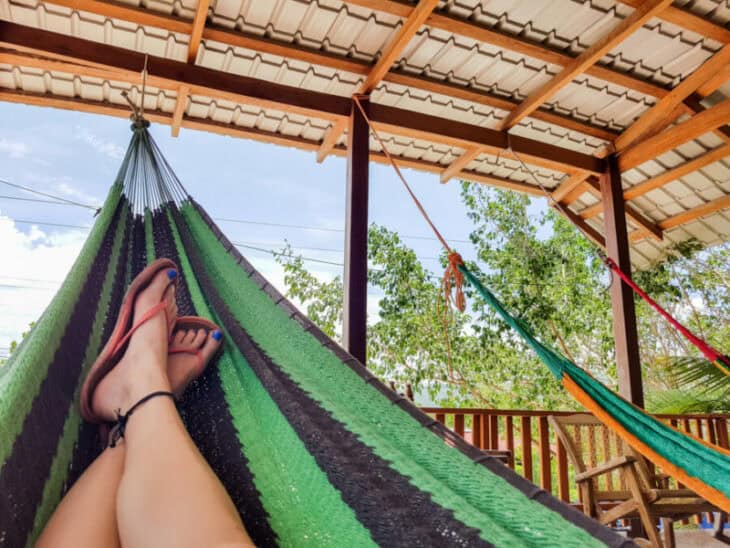 Budget traveler lying in a hammock