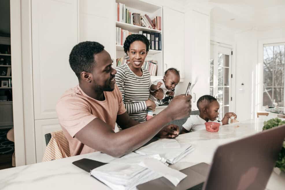 A parent teaching their family lessons about savings.