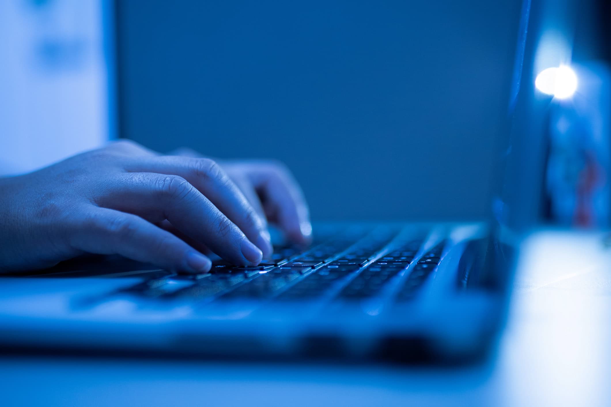 hands on keyboard in the dark