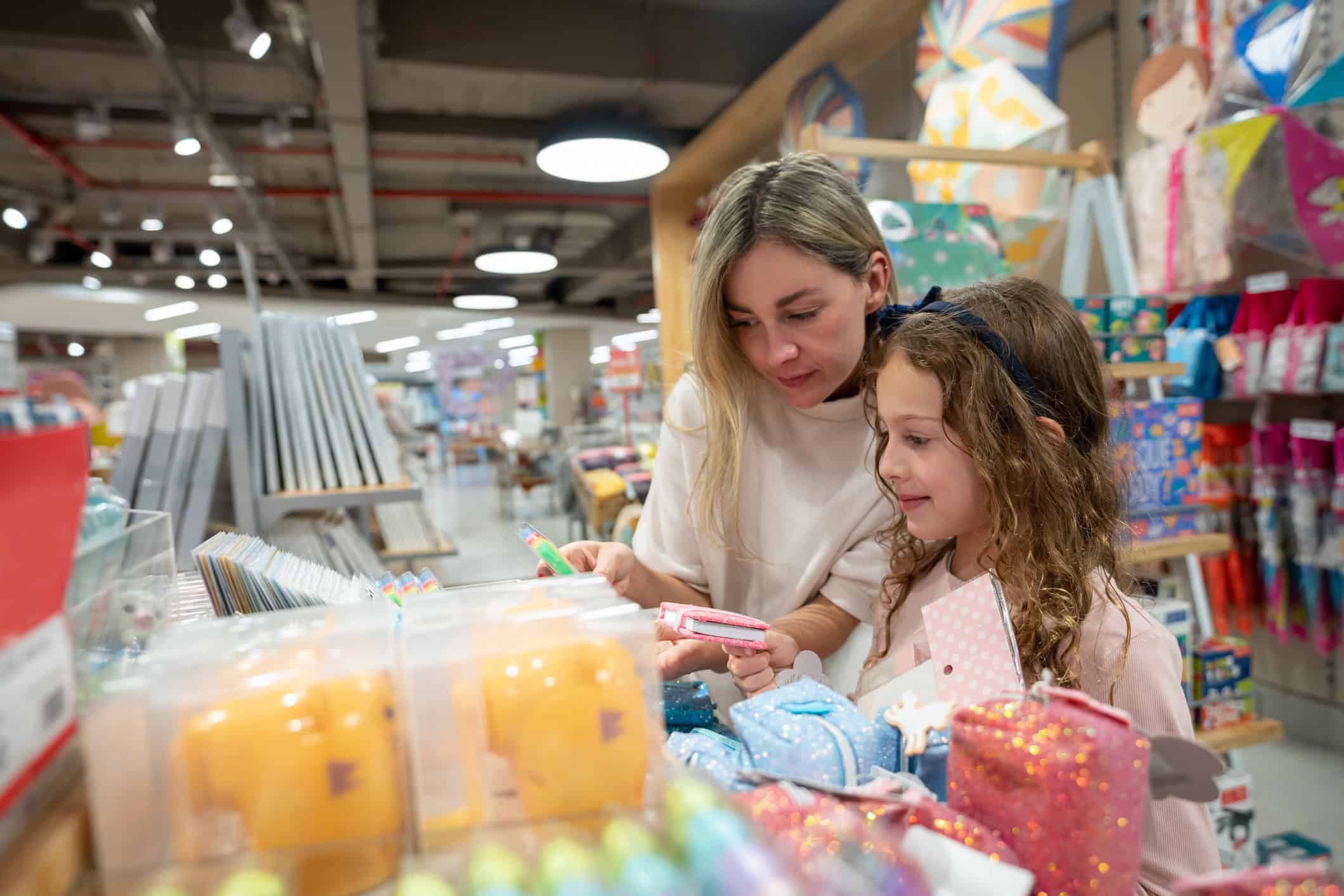 A parent and child back to school shopping on a budget.