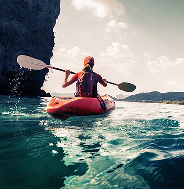 woman kayaking in the ocean