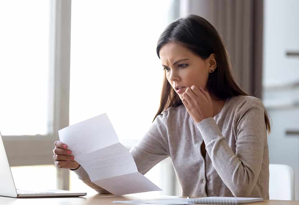 Woman opening scam letter